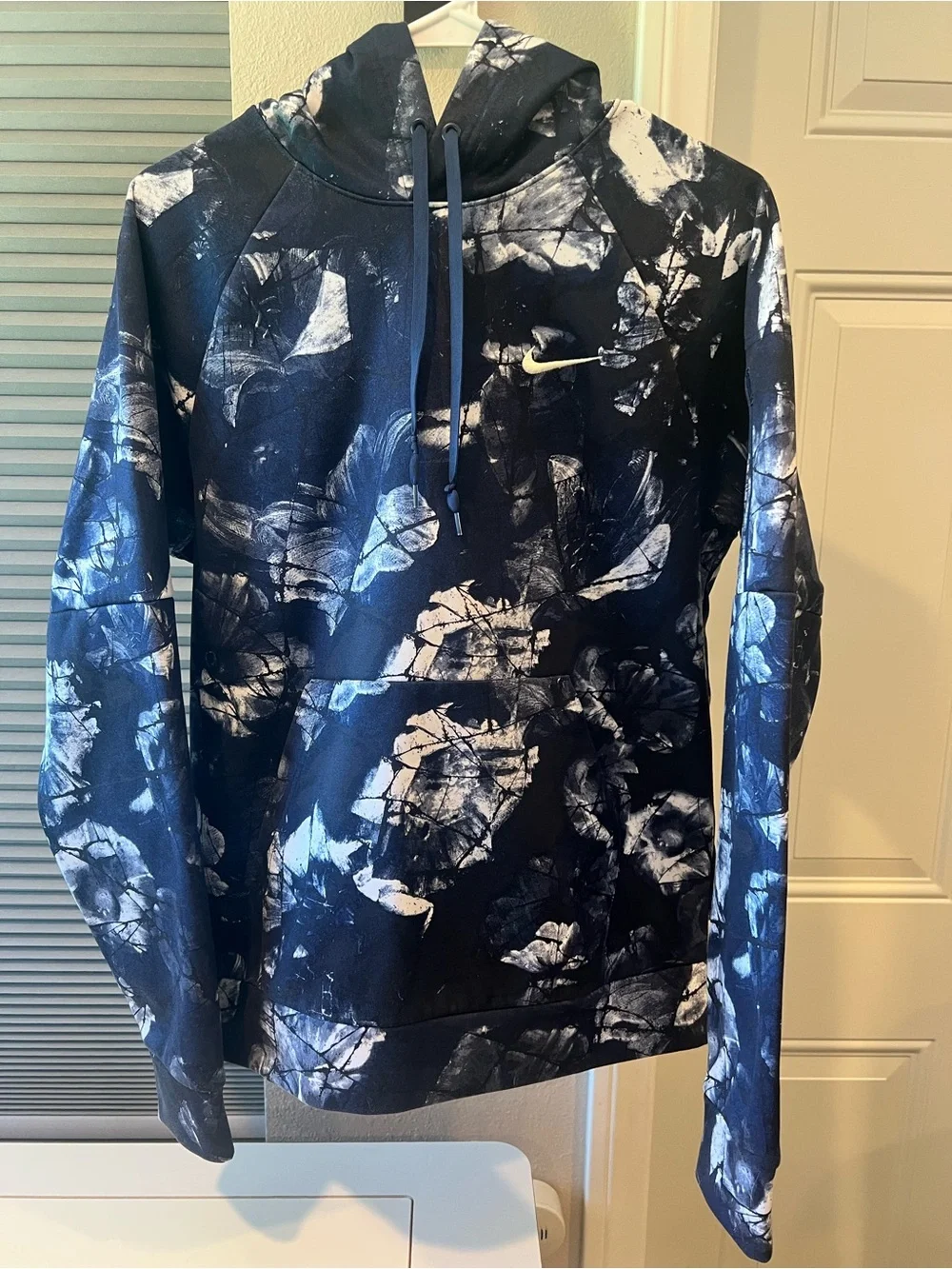 Nike Therma-Fit pullover hoodie with blue and white floral print
